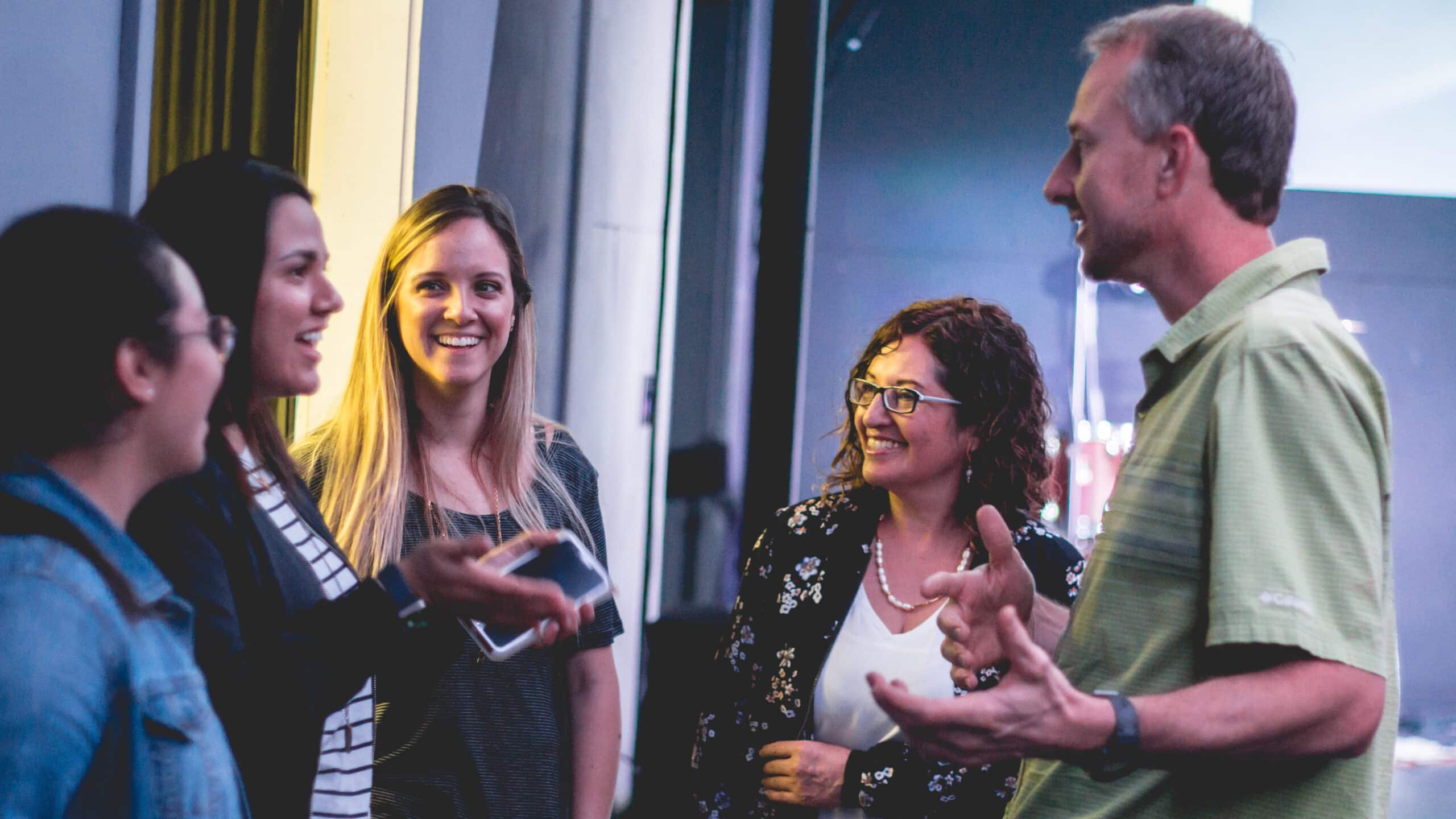 church media team gathered encouraging volunteers conversations
