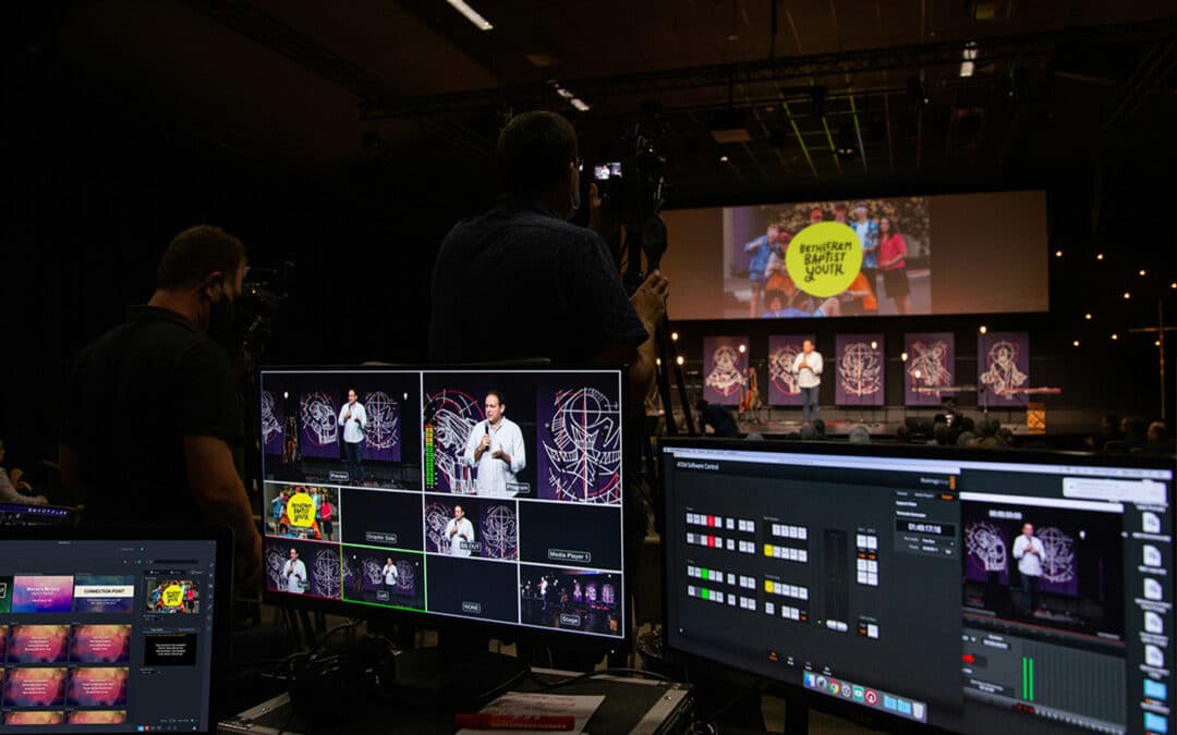 mediashout presentation software on screen next to a video mixer and switcher at a church